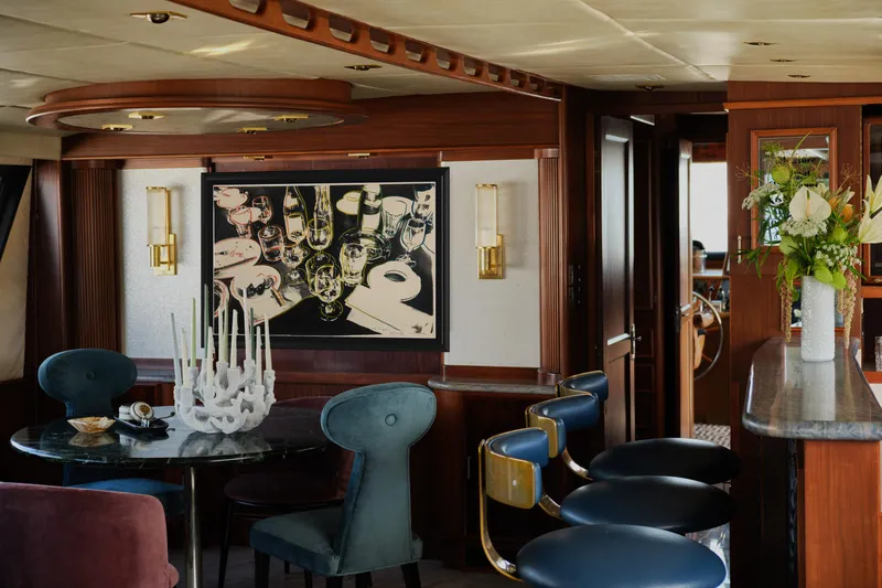 Slide: The Image of Luxurious interior of a 1981 Hatteras Motor Yacht with elegant seating and decor. - 14