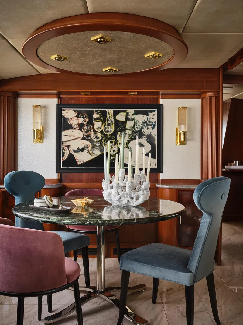 Slide: The Image of Luxurious dining area in a 1981 Hatteras Motor Yacht with elegant decor and modern furnishings. - 15