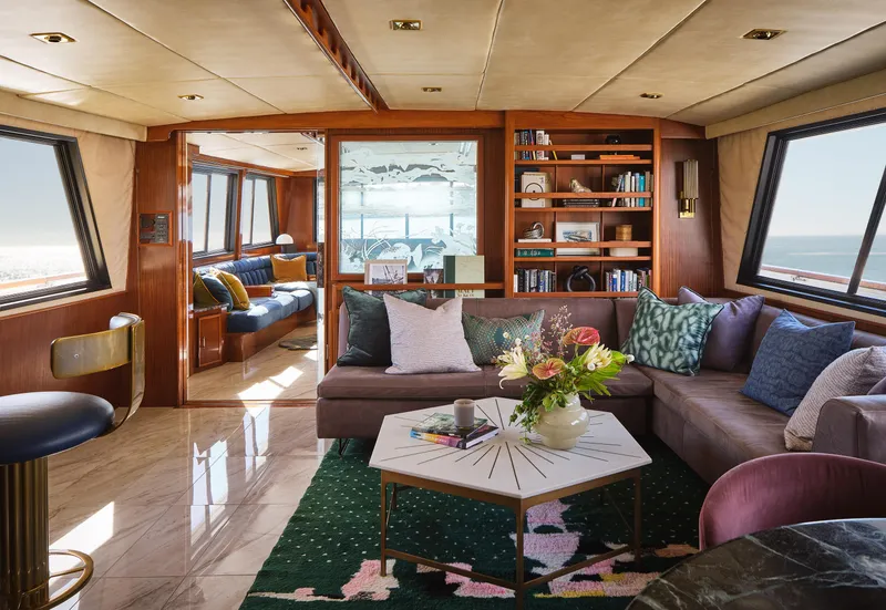 Slide: The Image of Luxurious interior of a 1981 Hatteras Motor Yacht with elegant seating and decor. - 16