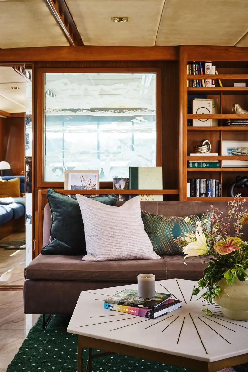 Slide: The Image of Luxurious interior of a 1981 Hatteras Motor Yacht with elegant decor and cozy seating. - 17