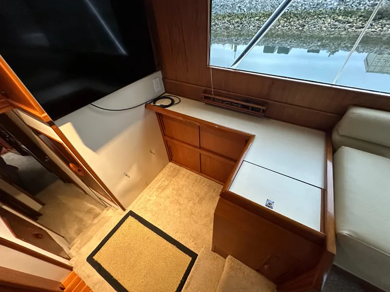 Slide: The Image of 1988 Buddy Davis Convertible interior with wooden cabinetry and carpeted flooring. - 21