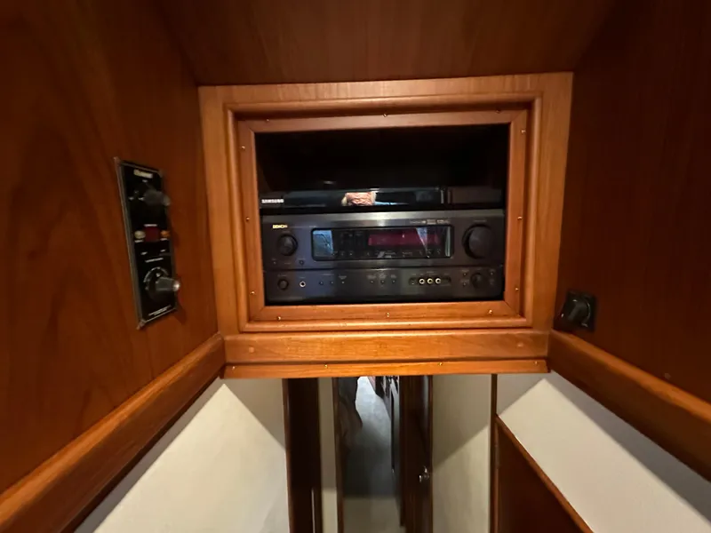 Slide: The Image of 1988 Buddy Davis Convertible interior with built-in stereo system and wooden cabinetry. - 25