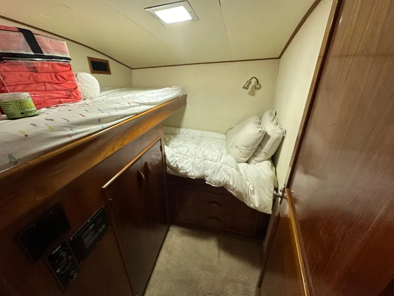 Slide: The Image of 1988 Buddy Davis Convertible cabin with bunk beds and cozy interior. - 33