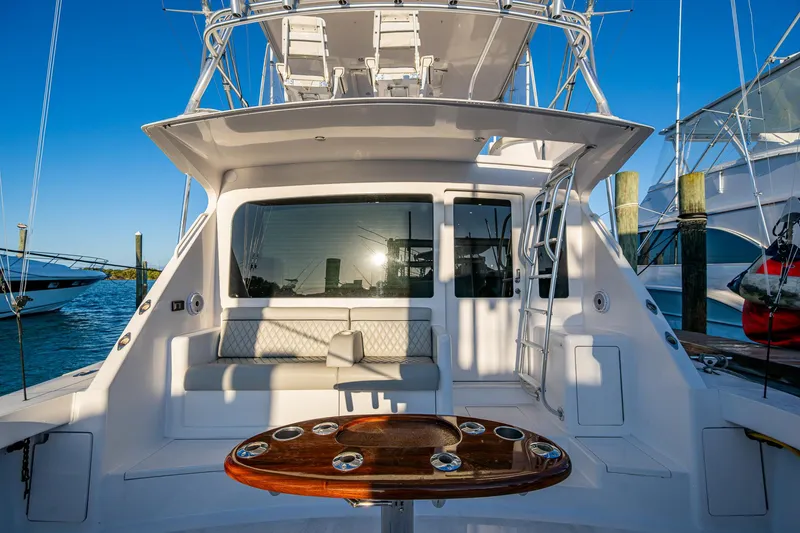 Slide: The Image of 2005 Viking 52 Convertible yacht with spacious deck and seating area. - 10