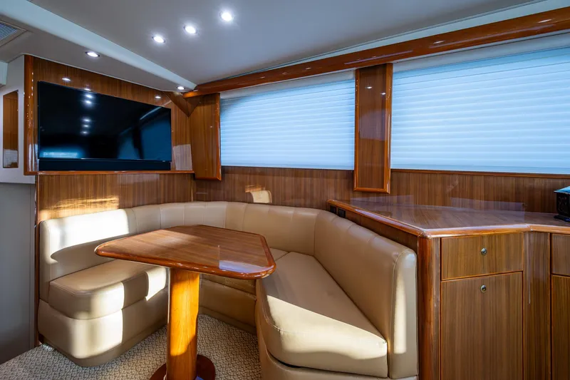 Slide: The Image of Luxurious interior of 2005 Viking 52 Convertible yacht with leather seating and wood finishes. - 19