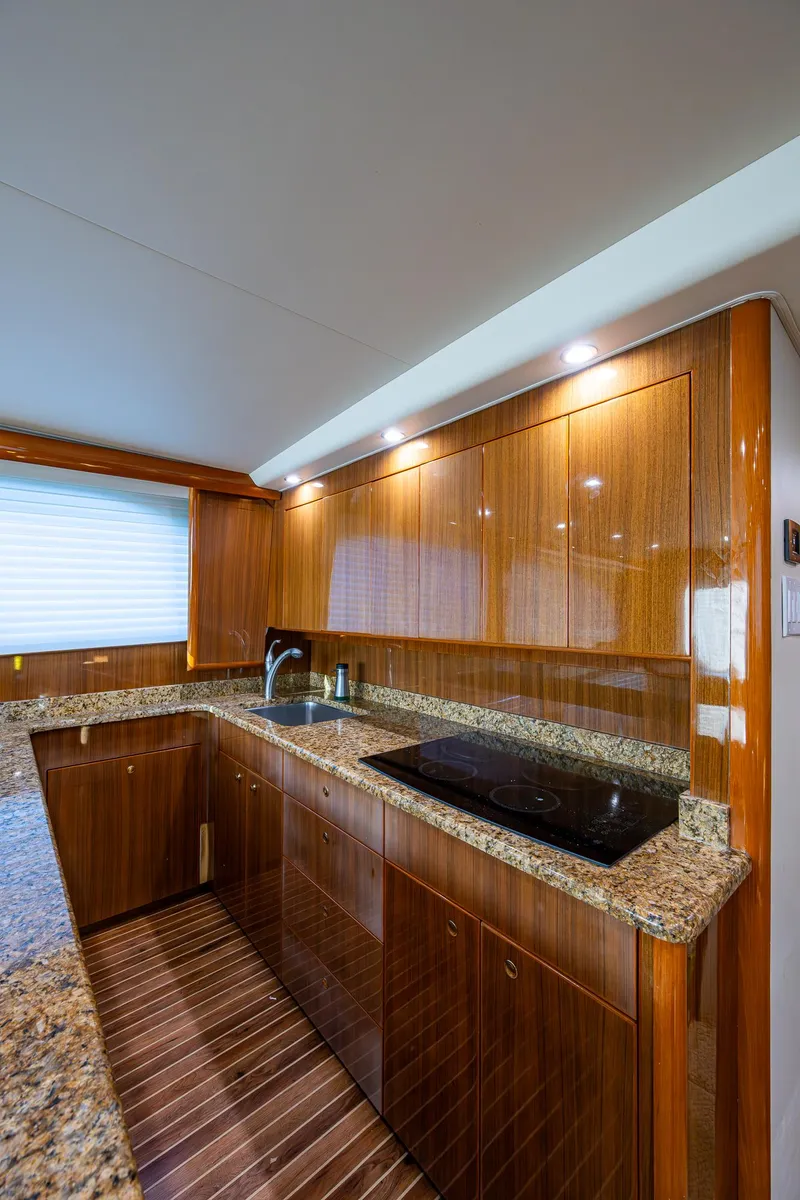 Slide: The Image of Luxurious kitchen interior of 2005 Viking 52 Convertible yacht with granite countertops. - 47