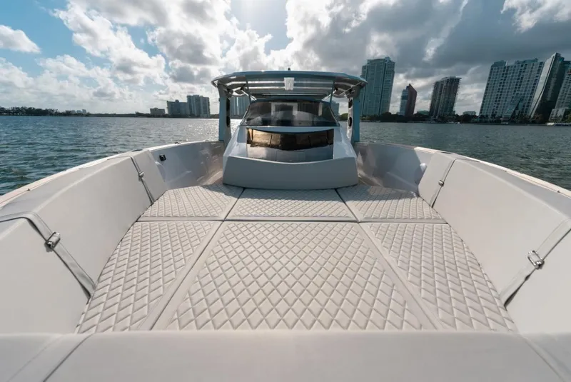 Slide: The Image of 2022 Tesoro T40 Outboard boat on water with city skyline in background. - 15