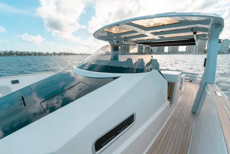 Slide: The Image of 2022 Tesoro T40 Outboard yacht on water, featuring sleek design and modern architecture. - 18