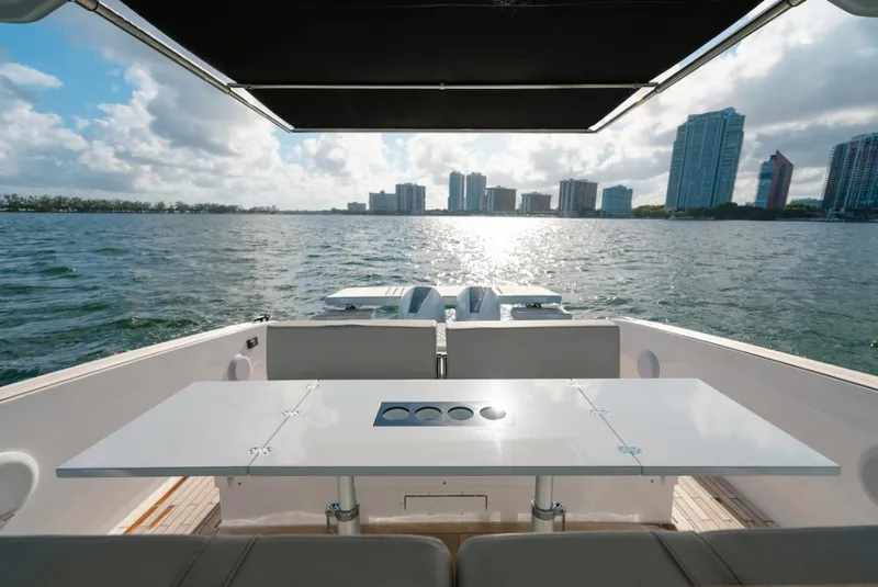 Slide: The Image of 2022 Tesoro T40 Outboard boat with scenic waterfront city skyline view. - 19