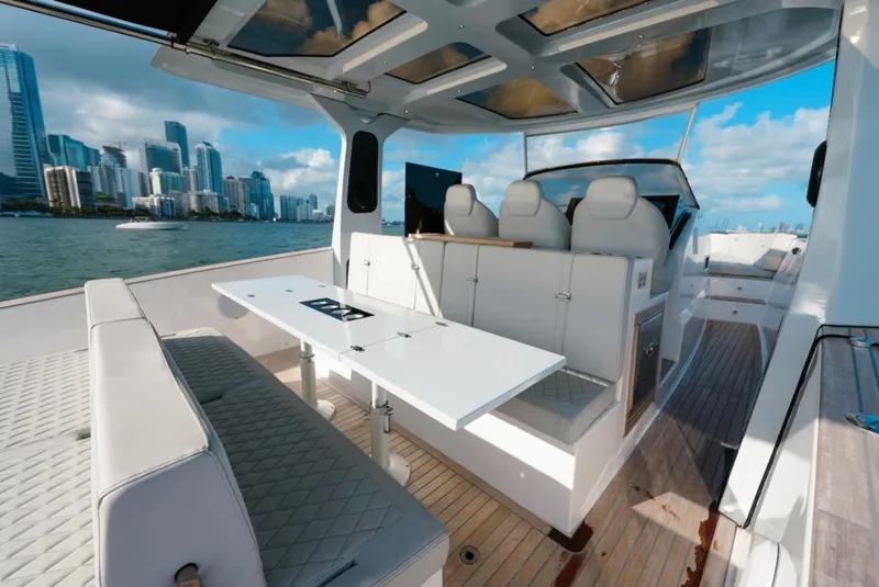 Slide: The Image of 2022 Tesoro T40 Outboard luxury yacht interior with city skyline in the background. - 20
