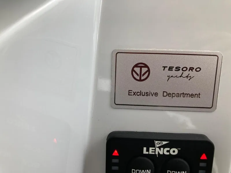 Slide: The Image of Plaque on 2022 Tesoro T40 Outboard, labeled "Exclusive Department," with Lenco control panel. - 23