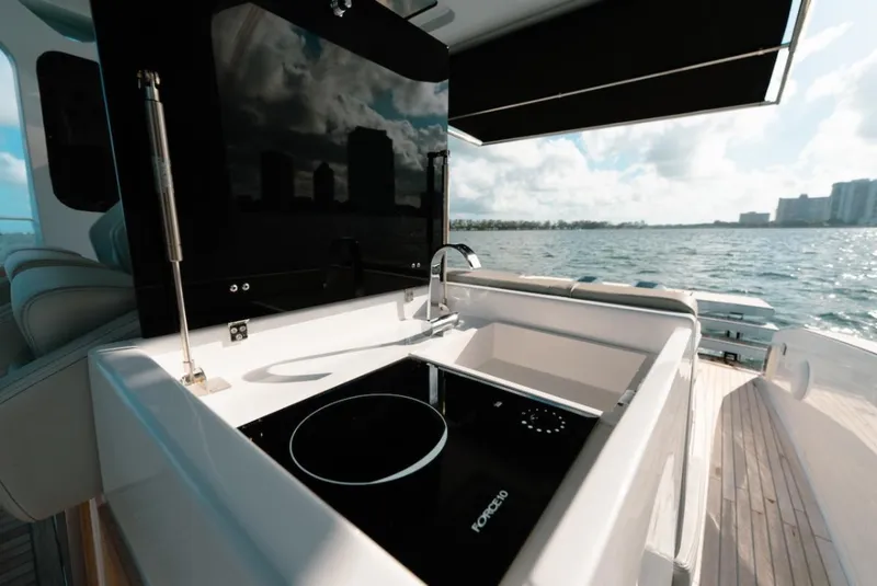 Slide: The Image of Outdoor kitchen on 2022 Tesoro T40 Outboard yacht with scenic ocean view. - 7
