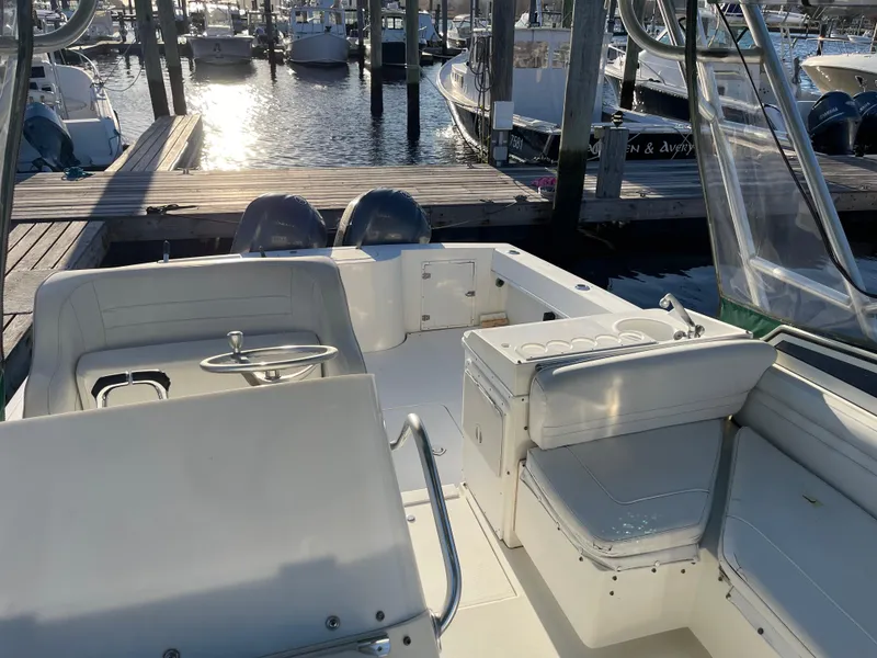 Slide: The Image of 1999 Contender 35 Express Side Console boat docked at marina, interior view. - 18