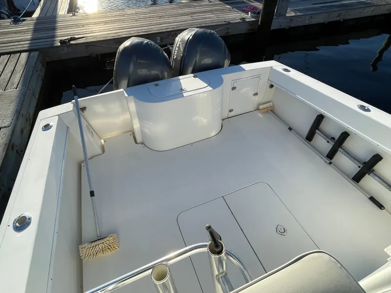 Slide: The Image of 1999 Contender 35 Express Side Console boat with twin engines at dock. - 25