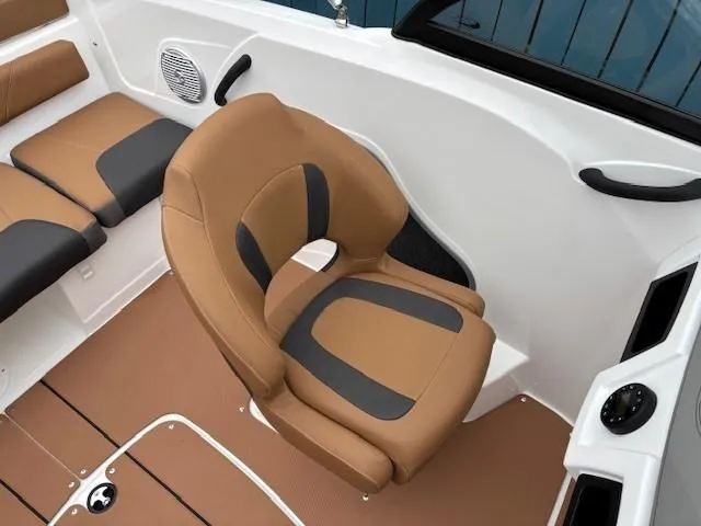 Slide: The Image of 2025 Tahoe 185 S boat interior with tan and black seating. - 14