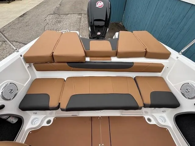 Slide: The Image of 2025 Tahoe 185 S boat interior with tan and black seating, showcasing modern design. - 15