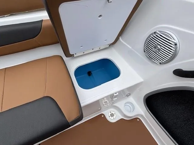 Slide: The Image of 2025 Tahoe 185 S boat interior with storage compartment and speaker. - 16