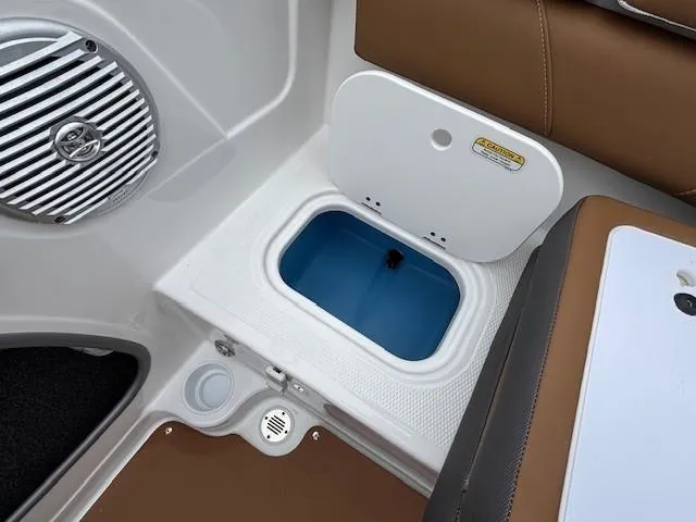 Slide: The Image of 2025 Tahoe 185 S boat interior with open storage compartment and speaker. - 17