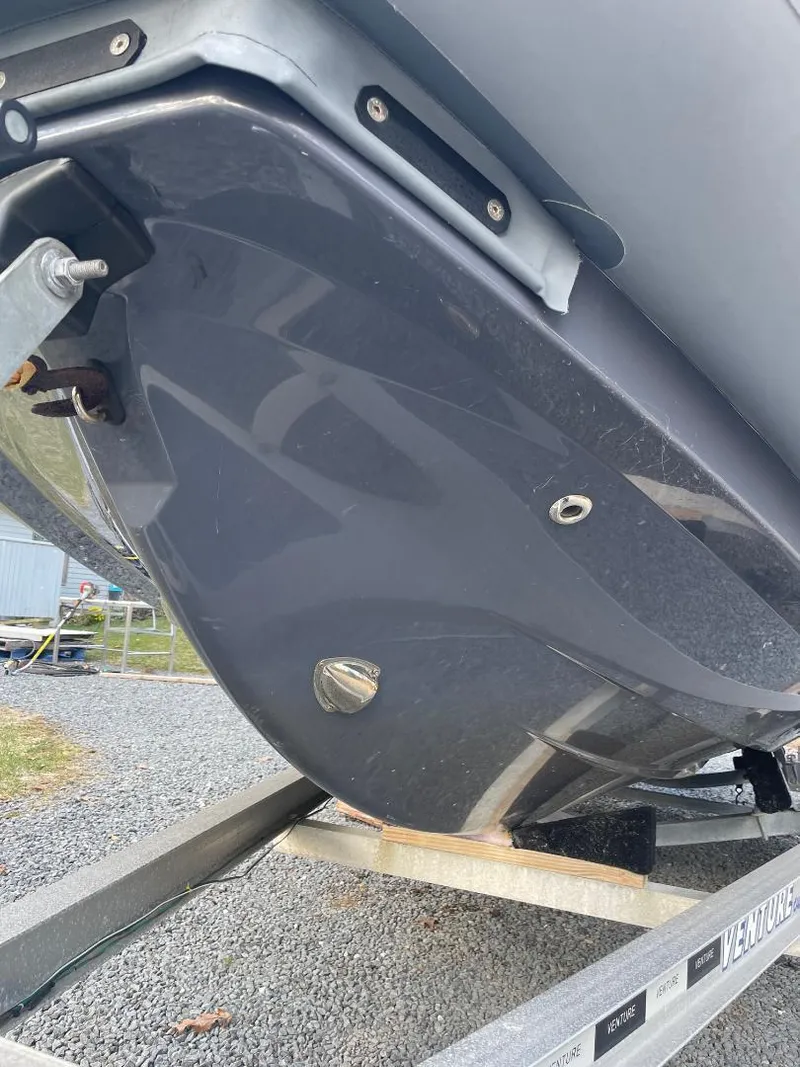 Slide: The Image of 2020 Zodiac Open 6.5 boat hull on trailer, close-up view. - 19