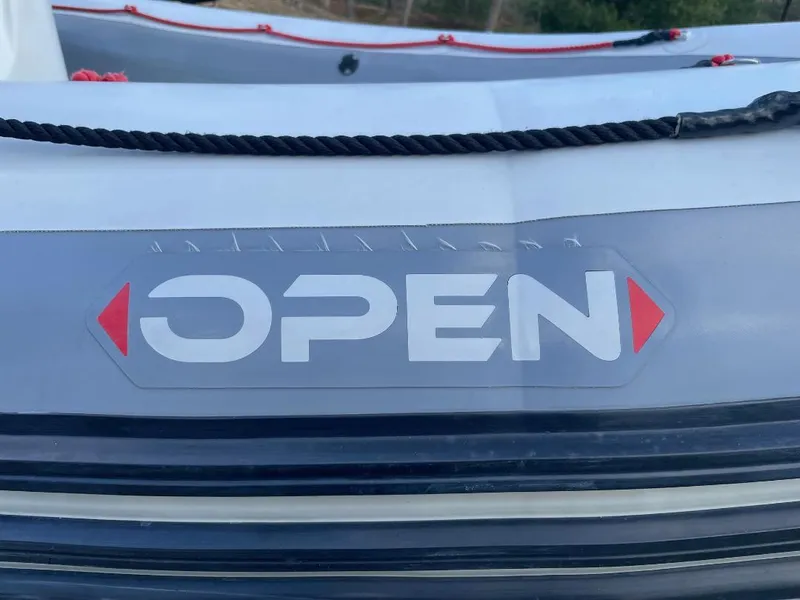 Slide: The Image of 2020 Zodiac Open 6.5 boat with visible branding and rope detail. - 22