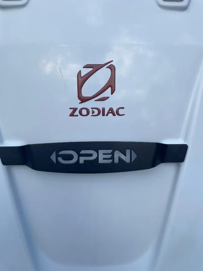 Slide: The Image of 2020 Zodiac Open 6.5 boat logo on white surface. - 8