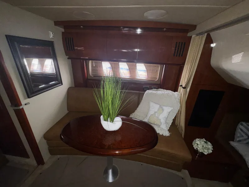 Slide: The Image of Interior of 2006 Sea Ray 380 Sundancer with cozy seating and elegant decor. - 16