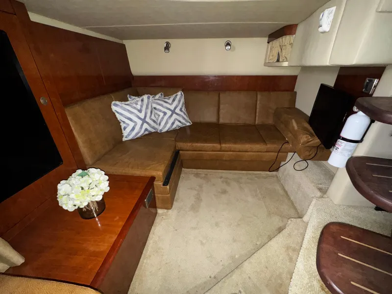 Slide: The Image of Interior of 2006 Sea Ray 380 Sundancer with cozy seating and elegant decor. - 17