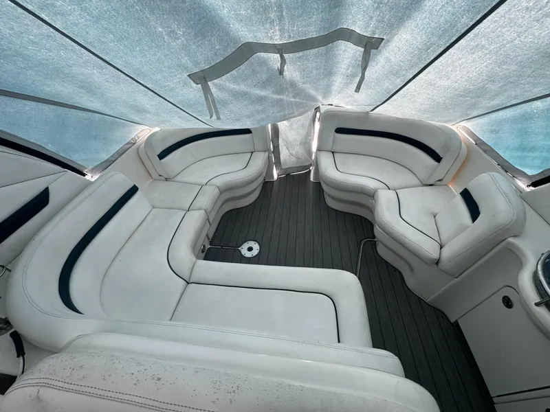 Slide: The Image of 2006 Sea Ray 380 Sundancer interior with white leather seating and sleek design. - 3