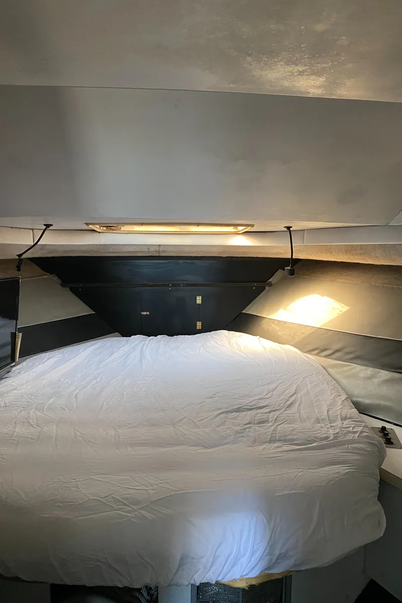 Slide: The Image of Interior cabin of 1991 Mainship 41 Convertible with bed and lighting. - 21