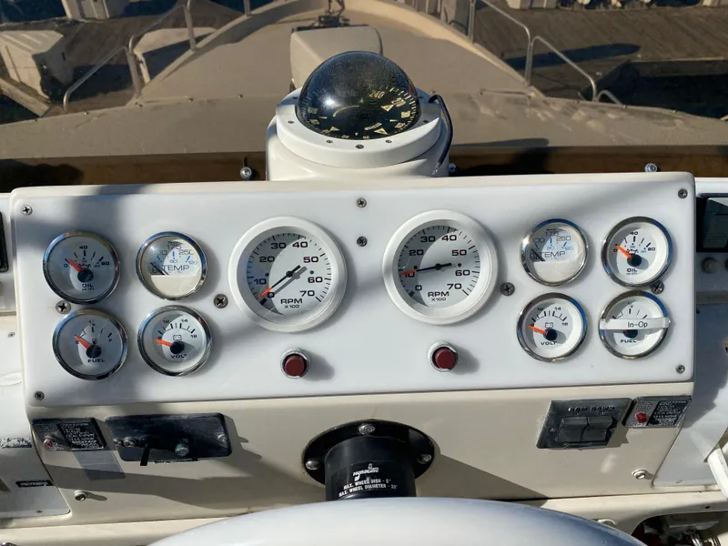 Slide: The Image of 1991 Mainship 41 Convertible dashboard with gauges and compass. - 6