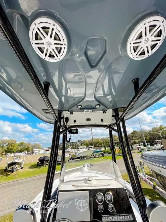 Slide: The Image of 2022 Tidewater 2210 Carolina Bay boat interior with speakers and control panel. - 11