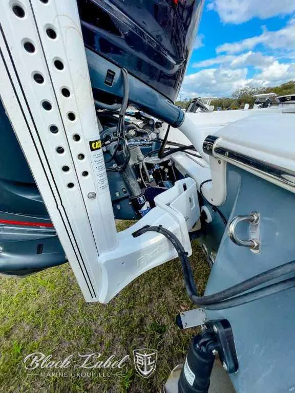 Slide: The Image of 2022 Tidewater 2210 Carolina Bay boat with motor and equipment details. - 3