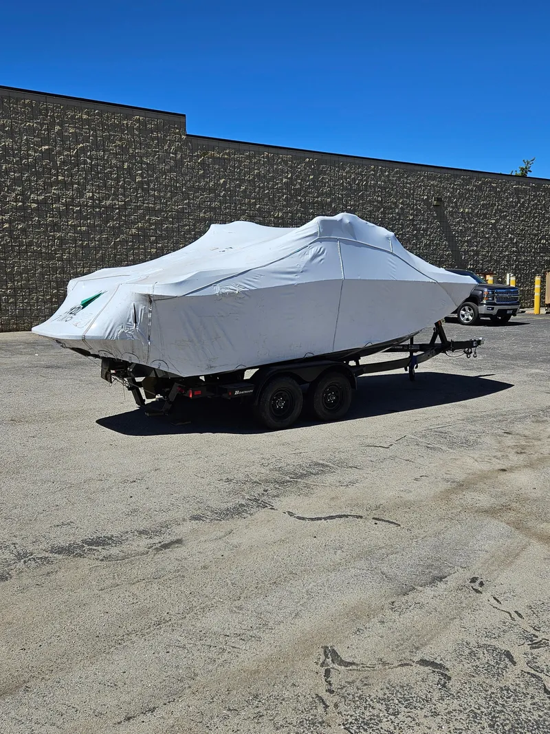 Slide: The Image of 2023 HEYDAY WAKE BOATS H20 covered on trailer in parking lot. - 6
