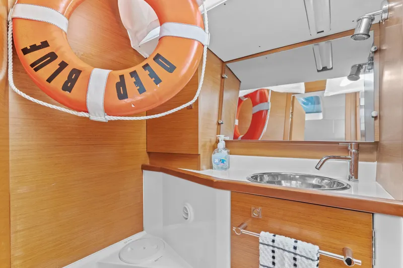Slide: The Image of Bathroom interior of 2020 Jeanneau Sun Odyssey 389 yacht with life preserver. - 24