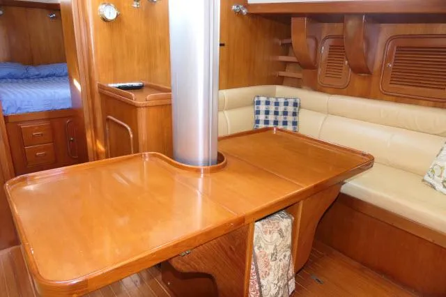 Slide: The Image of Luxurious wooden interior of 2002 Tayana 460 Vancouver Pilothouse yacht with dining area. - 17