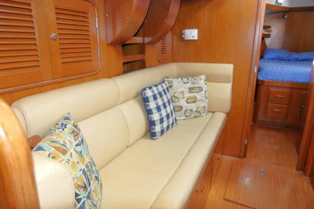 Slide: The Image of Luxurious interior of 2002 Tayana 460 Vancouver Pilothouse with cozy seating and cushions. - 18
