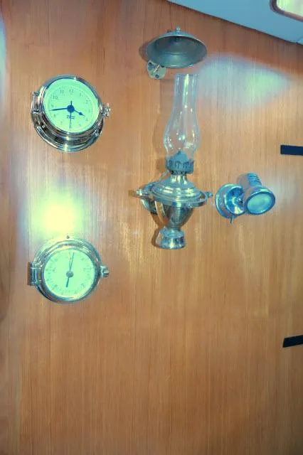 Slide: The Image of Wall-mounted nautical instruments and lamp on Tayana 460 Vancouver Pilothouse, 2002 model. - 20