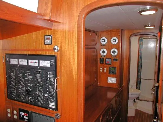 Slide: The Image of Interior of 2002 Tayana 460 Vancouver Pilothouse with control panels and wooden finish. - 26