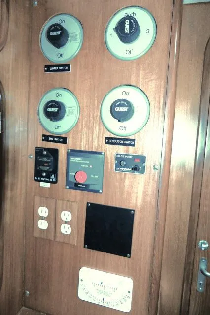 Slide: The Image of Control panel of 2002 Tayana 460 Vancouver Pilothouse with switches and outlets. - 29