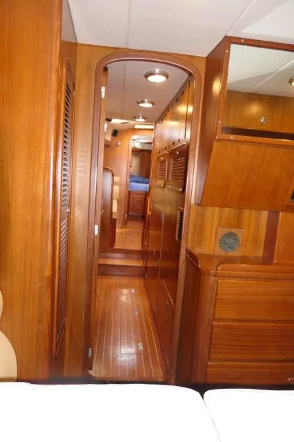 Slide: The Image of Interior of 2002 Tayana 460 Vancouver Pilothouse with wooden finishes and cozy cabin layout. - 46