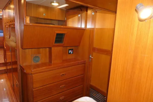 Slide: The Image of Interior of 2002 Tayana 460 Vancouver Pilothouse with wooden cabinetry and ambient lighting. - 47