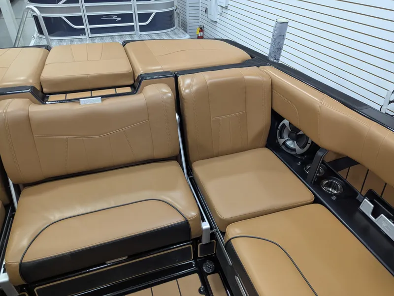 Slide: The Image of 2021 Malibu Wakesetter 24 MXZ interior with tan leather seating and sleek design. - 10