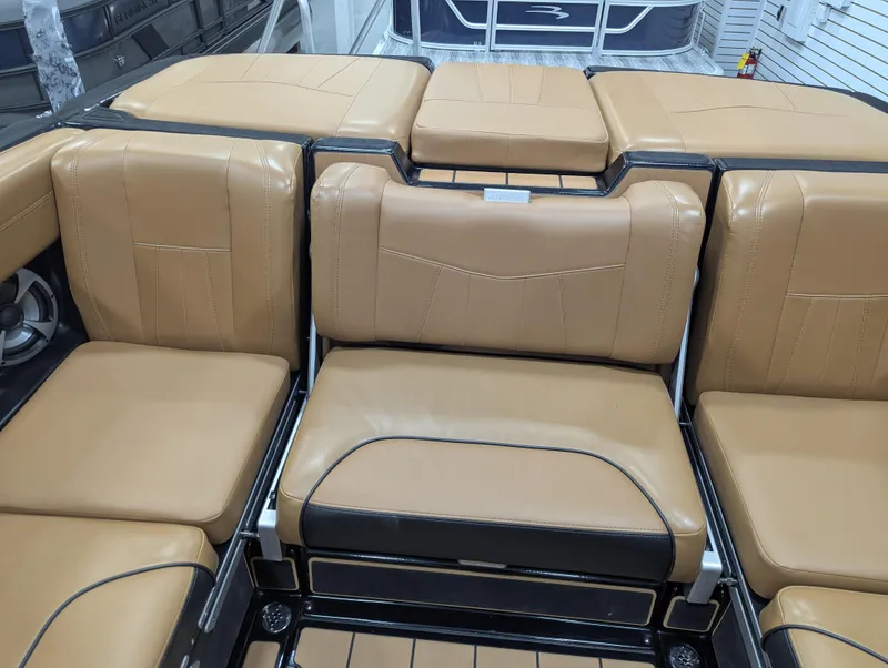 Slide: The Image of 2021 Malibu Wakesetter 24 MXZ interior with tan leather seating. - 15