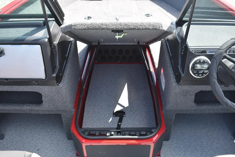 Slide: The Image of 2025 Lund 1775 Impact XS Sport boat interior with open storage compartment. - 13