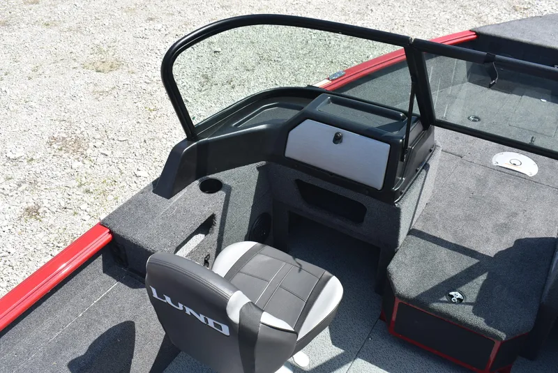 Slide: The Image of 2025 Lund 1775 Impact XS Sport boat interior with seating and console. - 8