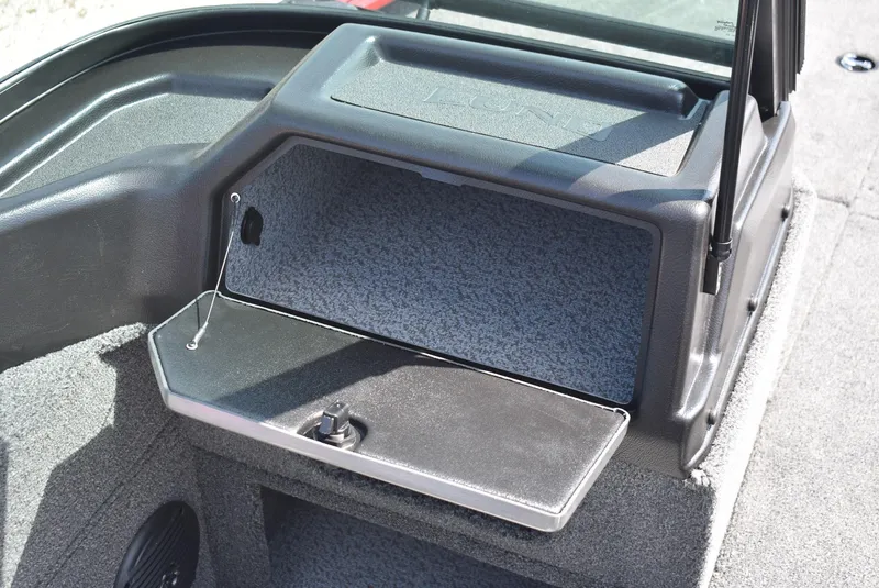 Slide: The Image of 2025 Lund 1775 Impact XS Sport boat interior storage compartment open. - 9