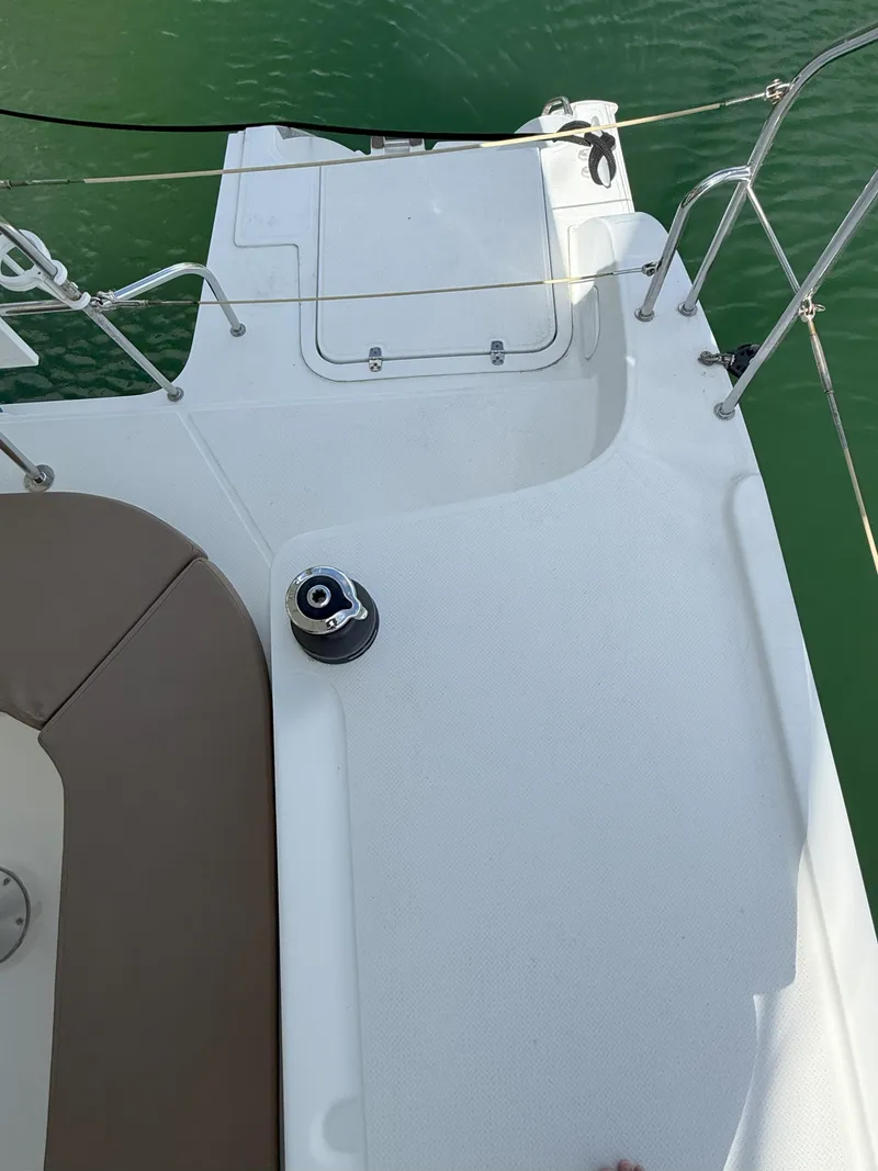 Slide: The Image of Deck view of 2014 Fountaine Pajot Mahe 36 Evolution catamaran, featuring sleek design and winch. - 22