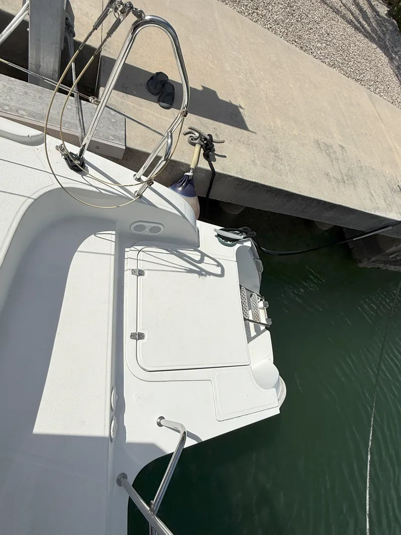 Slide: The Image of 2014 Fountaine Pajot Mahe 36 Evolution catamaran docked at marina. - 23