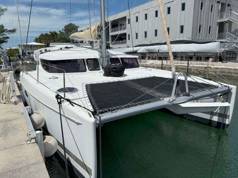 Slide: The Image of 2014 Fountaine Pajot Mahe 36 Evolution catamaran docked at marina. - 5