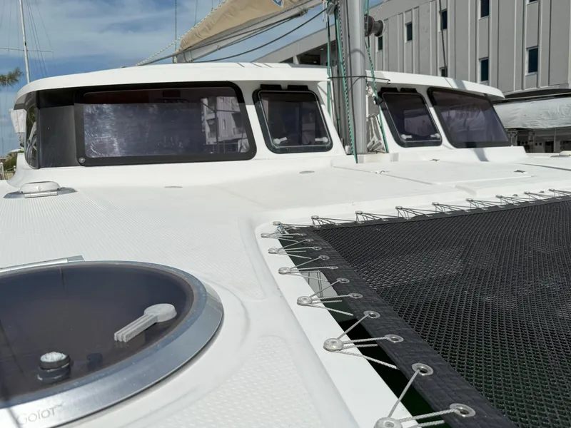 Slide: The Image of 2014 Fountaine Pajot Mahe 36 Evolution catamaran deck with netting and windows. - 12
